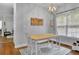 Cozy dining area features natural light, hardwood floors, and a white table at 41 Spring Nw Ln, Atlanta, GA 30314