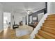 Sunlit living room featuring hardwood floors, staircase, and an adjoining office space at 41 Spring Nw Ln, Atlanta, GA 30314