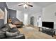 Spacious living room with hardwood floors, piano, and doorway to another room at 41 Spring Nw Ln, Atlanta, GA 30314