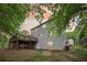 A view of the back exterior of the house, with a large deck at 6230 Lillie Ln, Cumming, GA 30040