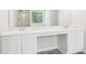 Bright bathroom featuring double vanity and large mirror at 6230 Lillie Ln, Cumming, GA 30040