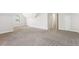Bedroom featuring neutral carpet, bright white walls, and 2 doorways at 6230 Lillie Ln, Cumming, GA 30040