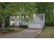 Charming two-story home with a well-manicured lawn and attached two-car garage at 6230 Lillie Ln, Cumming, GA 30040