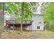 Exterior of home with an expansive deck offering plenty of outdoor living space at 6230 Lillie Ln, Cumming, GA 30040