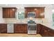 Well-equipped kitchen with stainless steel appliances, including a gas range and backsplash at 6230 Lillie Ln, Cumming, GA 30040