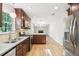 Spacious kitchen with modern appliances, including a gas range and a view into the living room at 6230 Lillie Ln, Cumming, GA 30040