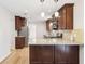 Well-lit kitchen with stainless steel appliances, rich wood cabinetry, and a center island at 6230 Lillie Ln, Cumming, GA 30040