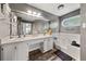 Bathroom with double sinks, soaking tub, and natural light at 135 Dunwick Ln, Mcdonough, GA 30253