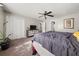Spacious bedroom featuring a ceiling fan, closet, and neutral paint at 135 Dunwick Ln, Mcdonough, GA 30253