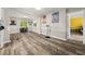 Spacious dining area with modern flooring and access to other rooms at 135 Dunwick Ln, Mcdonough, GA 30253