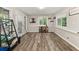 Bright dining area with backyard access, showcasing stylish flooring and natural light at 135 Dunwick Ln, Mcdonough, GA 30253