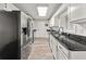 Modern kitchen with granite countertops and stainless steel appliances at 135 Dunwick Ln, Mcdonough, GA 30253