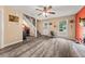 Open-concept living area with staircase and ample natural light at 135 Dunwick Ln, Mcdonough, GA 30253