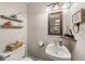 Cozy powder room features a floating vanity and modern decor at 135 Dunwick Ln, Mcdonough, GA 30253