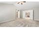 Spacious bedroom with vaulted ceiling leading to bathroom with double doors at 144 Nocatee Trl, Woodstock, GA 30188