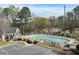 Community pool with lounge chairs and tables, perfect for enjoying sunny days and relaxation at 144 Nocatee Trl, Woodstock, GA 30188
