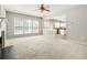 Open-concept living room shows fireplace and a view to the kitchen at 144 Nocatee Trl, Woodstock, GA 30188