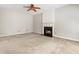Living room showcasing a fireplace with white mantel and carpet floors at 144 Nocatee Trl, Woodstock, GA 30188