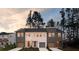 Charming townhome featuring a mix of siding colors, a driveway and an attached garage at 1670 Gunnin Nw Trce # 256, Atlanta, GA 30318