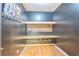 Basement room with wood floors and workbench ready for a multitude of hobbies at 2260 Cobble Creek Ln, Grayson, GA 30017