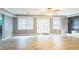 Inviting basement area with a ceiling fan and double doors to the outdoor patio at 2260 Cobble Creek Ln, Grayson, GA 30017