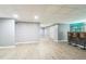 Finished basement features modern flooring, recessed lighting, a dry bar, and walk-out access at 2260 Cobble Creek Ln, Grayson, GA 30017