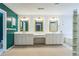 The primary bath has a vanity with triple sinks, ample storage, and framed mirrors at 2260 Cobble Creek Ln, Grayson, GA 30017