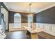 Dining area featuring a modern chandelier, hardwood flooring, neutral walls, and a bright ambiance at 2260 Cobble Creek Ln, Grayson, GA 30017