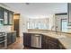 Well-lit kitchen with sleek appliances, wood countertops, and ample cabinet space at 2260 Cobble Creek Ln, Grayson, GA 30017