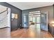 Stylish room showcasing hardwood floors, French doors, gray walls, dark trim, and designer touches at 2260 Cobble Creek Ln, Grayson, GA 30017