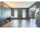 Living room with modern decor, dark walls, and hardwood flooring, offering a sophisticated ambiance at 2260 Cobble Creek Ln, Grayson, GA 30017