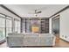 Comfortable living area boasting custom built-ins, a fireplace, hardwood floors, and a ceiling fan at 2260 Cobble Creek Ln, Grayson, GA 30017