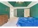 Spacious primary suite with dark teal walls, trey ceiling, carpeted floor, and doorway to primary bath at 2260 Cobble Creek Ln, Grayson, GA 30017