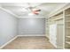 Office features built in shelving, a ceiling fan, and modern vinyl flooring at 2260 Cobble Creek Ln, Grayson, GA 30017