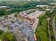 Aerial view of a commercial center with ample parking surrounded by a tree-lined setting at 4096 Vinings Mill Se Trl, Smyrna, GA 30080