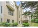Spacious backyard with manicured lawn, lush landscaping, and charming back porch at 4096 Vinings Mill Se Trl, Smyrna, GA 30080