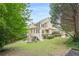 Expansive backyard featuring a charming elevated porch and lush green lawn at 4096 Vinings Mill Se Trl, Smyrna, GA 30080