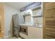 Basement wet bar with marble countertops, stainless fridge, and wine storage at 4096 Vinings Mill Se Trl, Smyrna, GA 30080