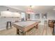 Finished basement with a wooden pool table and unique Coca-Cola light at 4096 Vinings Mill Se Trl, Smyrna, GA 30080