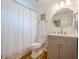 Charming bathroom featuring modern vanity, updated fixtures, and a shower with a white curtain at 4096 Vinings Mill Se Trl, Smyrna, GA 30080