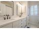 Bathroom with double vanity, modern faucets, white cabinets, and tiled floors at 4096 Vinings Mill Se Trl, Smyrna, GA 30080