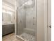 Elegant bathroom features a glass-enclosed shower with stylish tile and a modern vanity with marble countertop at 4096 Vinings Mill Se Trl, Smyrna, GA 30080