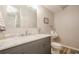 Modern bathroom showcasing a marble vanity, sleek fixtures, and a toilet with a urinal for added convenience at 4096 Vinings Mill Se Trl, Smyrna, GA 30080