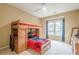Bedroom with a custom wood loft bed with desk, drawers and ceiling fan at 4096 Vinings Mill Se Trl, Smyrna, GA 30080