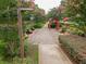 A peaceful pathway in a community garden, with beautiful flowers and benches at 4096 Vinings Mill Se Trl, Smyrna, GA 30080