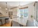 Cozy dining area featuring a marble table, stylish lighting, and bright windows at 4096 Vinings Mill Se Trl, Smyrna, GA 30080
