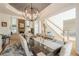 Open-concept dining room showcasing modern decor, a stylish chandelier, and seamless flow to the living areas at 4096 Vinings Mill Se Trl, Smyrna, GA 30080