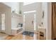 Bright entryway with hardwood floors, built-in bench, coat hooks and neutral decor at 4096 Vinings Mill Se Trl, Smyrna, GA 30080