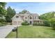 Charming two-story home features a two-car garage, manicured lawn, and classic architectural details at 4096 Vinings Mill Se Trl, Smyrna, GA 30080