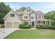 Stately two-story home with a manicured lawn, complemented by a two-car garage at 4096 Vinings Mill Se Trl, Smyrna, GA 30080